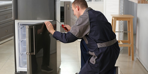 Appliance centre staff assisting customer